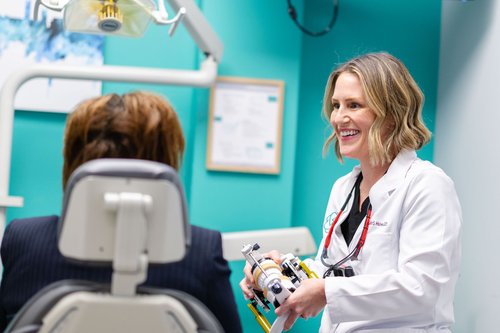 Dr. Hulver reviewing a dental model with a patient at Metropolitan Dental Centre