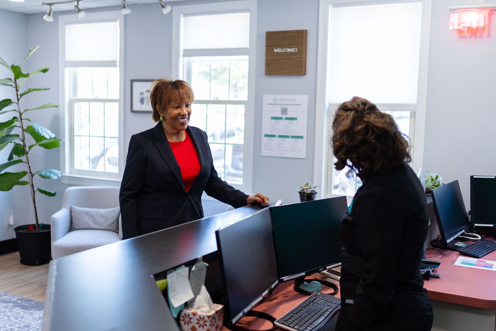 Front desk team discussing financing options with a patient